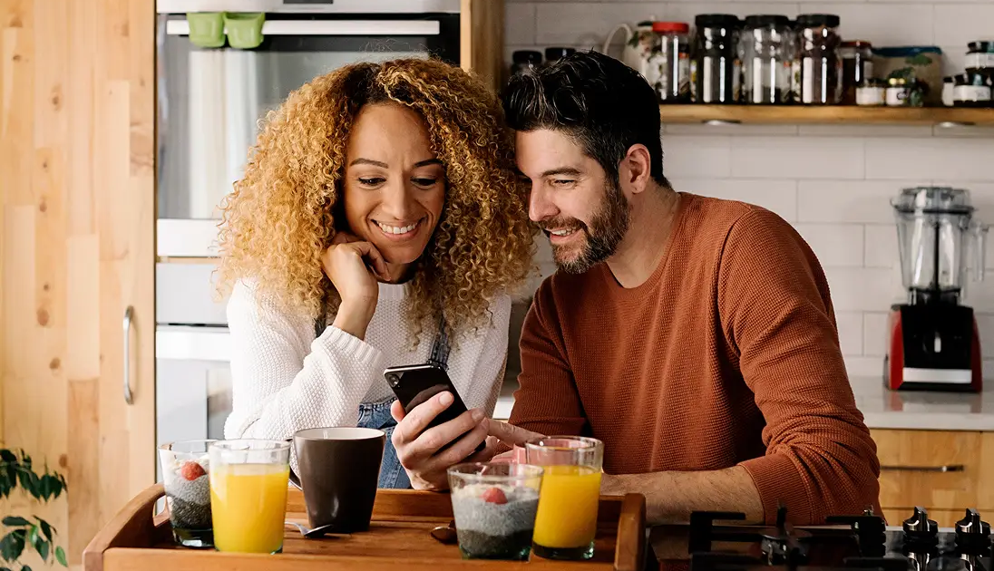 Couple looking At Phone, Mortgage Rate